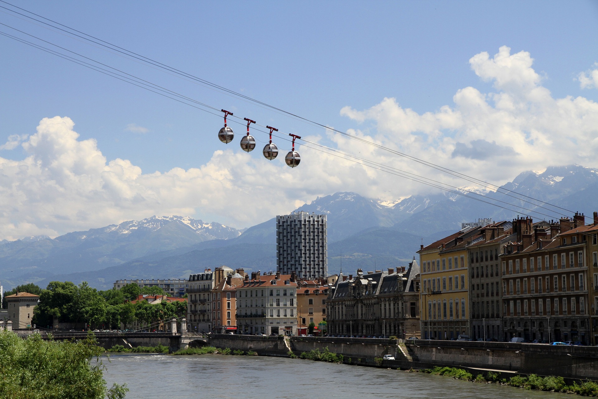 The city of Grenoble, the Alps in the distance